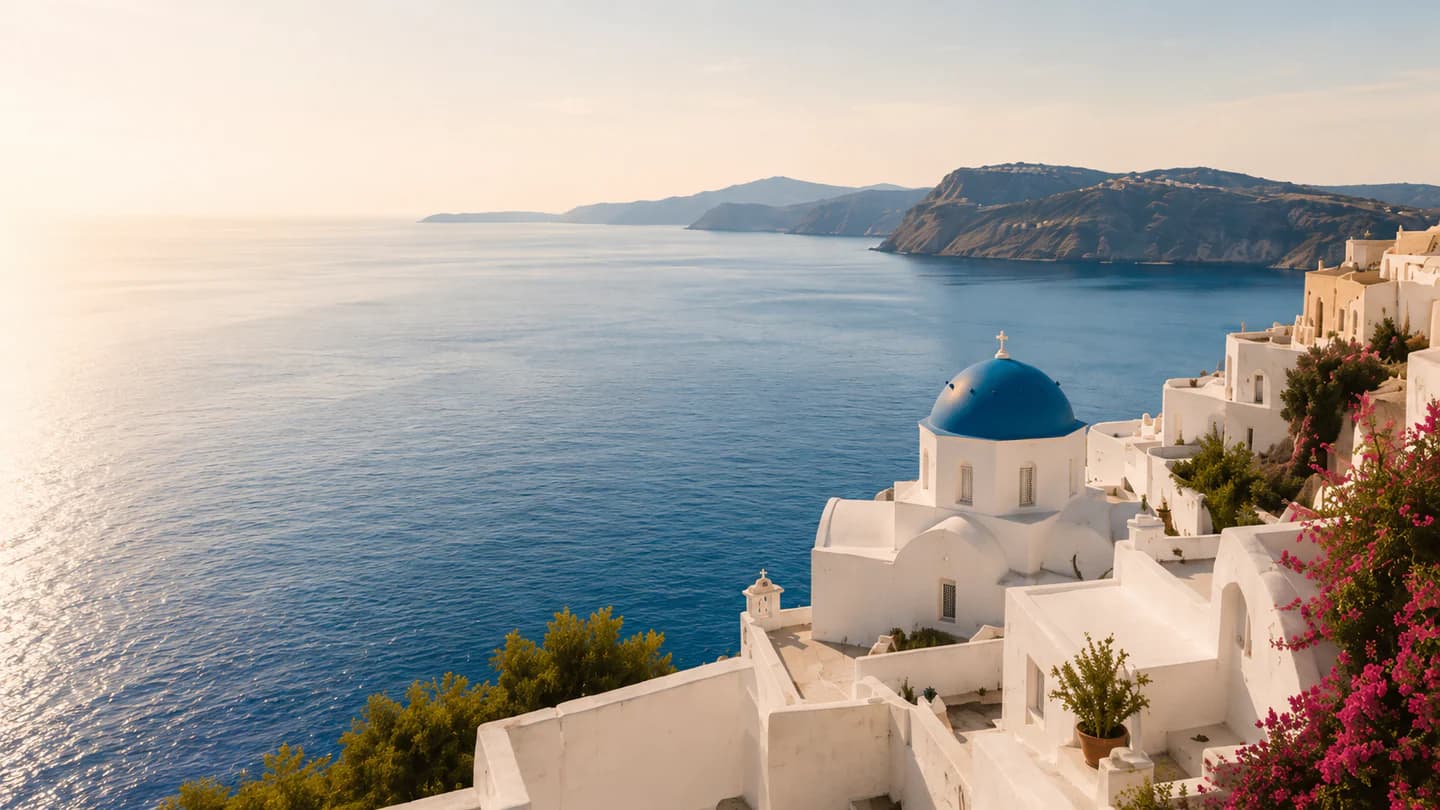 The whitewashed coastline and blue water of the Greek Islands