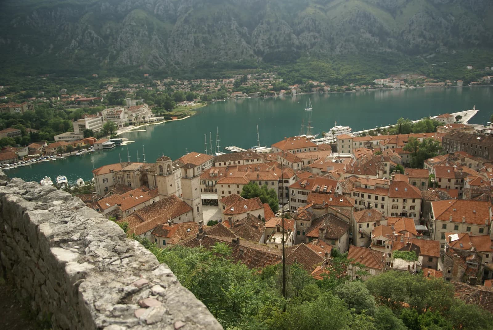 Kotor's red-roofed old town and harbor beneath the mountains of Montenegro