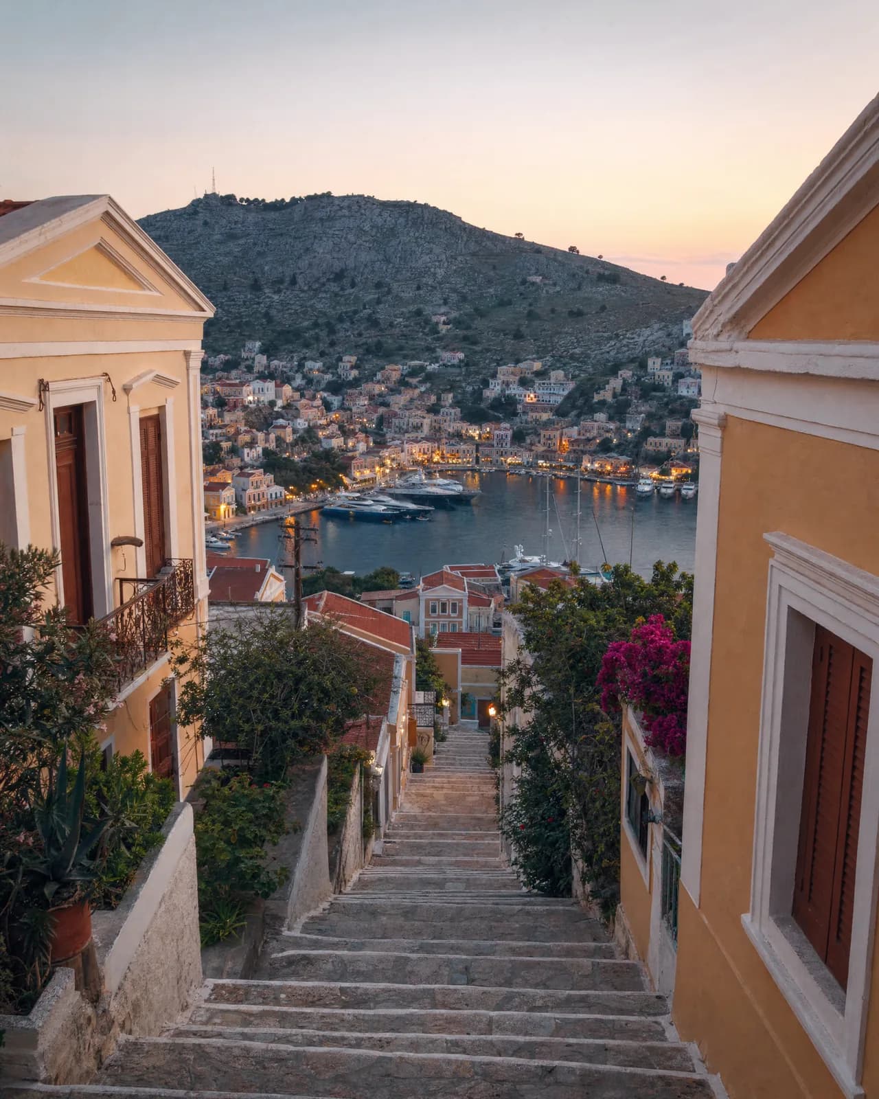The Kali Strata stairway above Symi harbor at dusk
