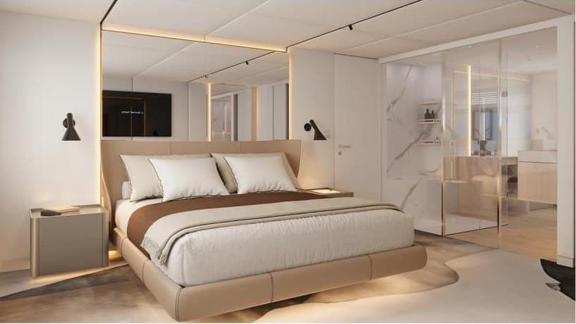 The owner's suite aboard SUE ROSSO, bed facing the ensuite
