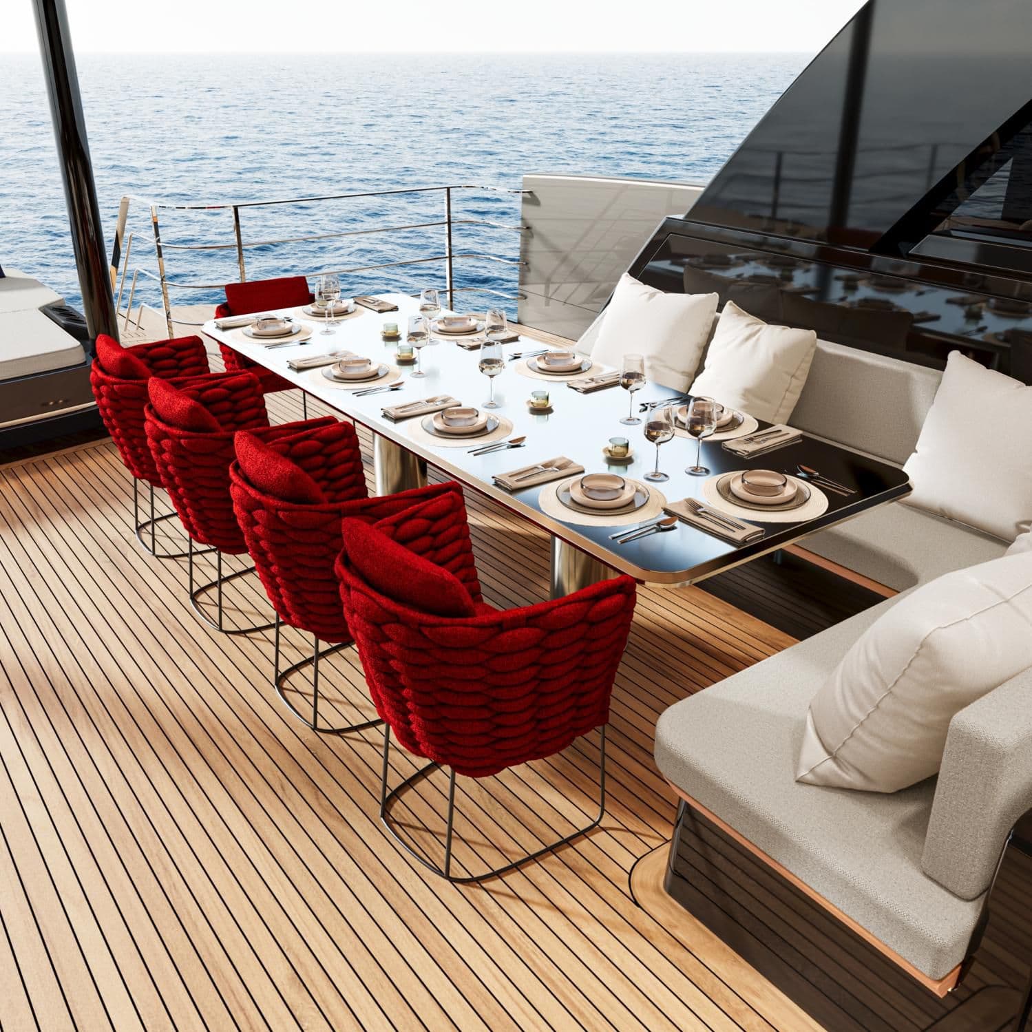 Lunch laid on deck aboard SUE ROSSO, red woven chairs against the open sea