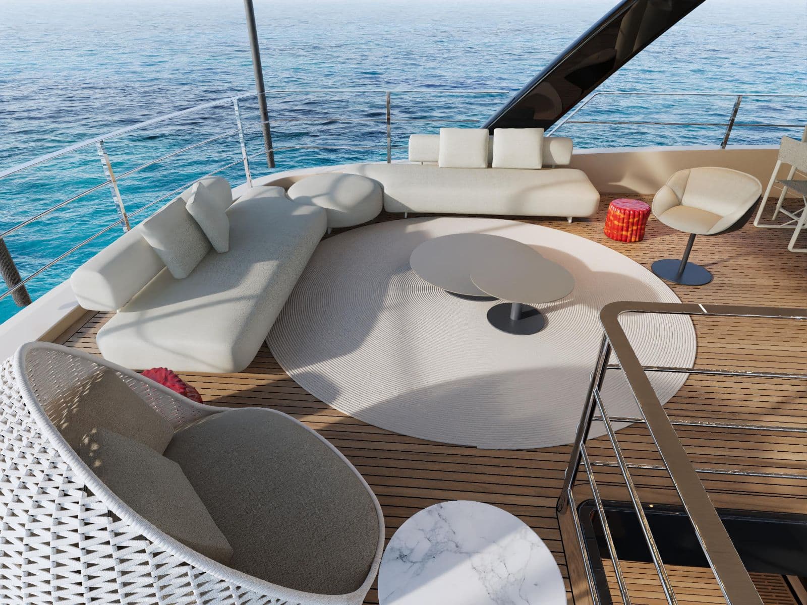Sunbeds and low tables on SUE ROSSO's forward deck, sea alongside